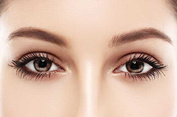 Closeup of a woman's eyes after oculoplastic surgery